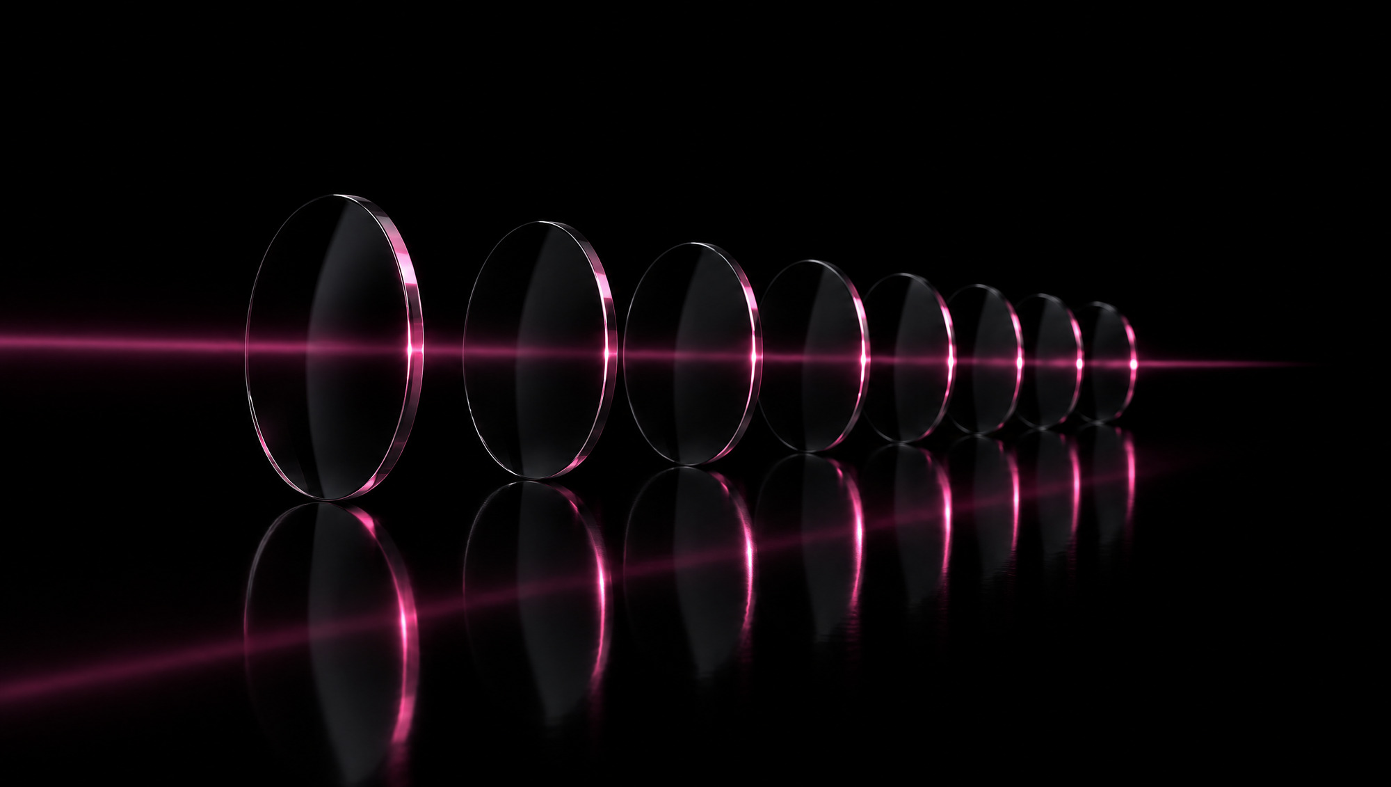 Black glass discs with a pink light beam passing through each in sequence